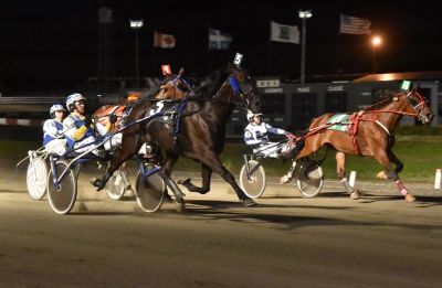 Capteur De Reve and driver Pierre Luc Roy come on to win the ,000 final for trotting horses.