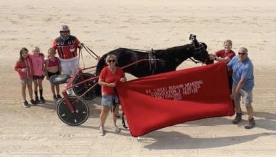 Race 5 Lone Star Tap trained and driven by Brandon Jenson won in 2:04 for owner Nancy Jenson Memorial blanket presentation by the family of B.E. (Jack) Budahn.