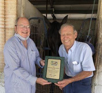 Blacksmith Phil Cable right receives a Lifetime Achievement Award
