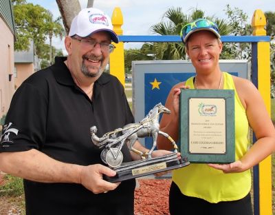 Casie Coleman Herlihy is presented the Francis Dodge Van Lennap Award and also accepts for Ed James, the McWicked Hall of Fame Trophy with Florida USHWA president Steve Wolf.