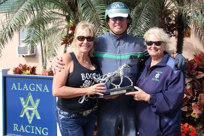 Left to Right are Florida Chapter USHWA member Victoria Howard present trainer Tony Alanga with his Hall of Fame trophy along with Tony's mom, Donna Lee.