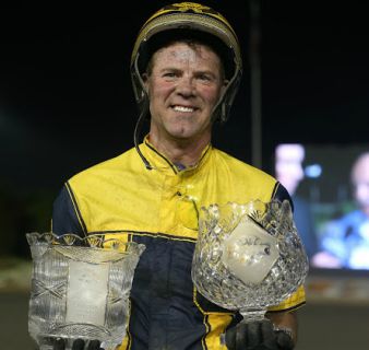 Randy Waples poses with the Metro Pace and Canadian Pacing Derby trophies.
